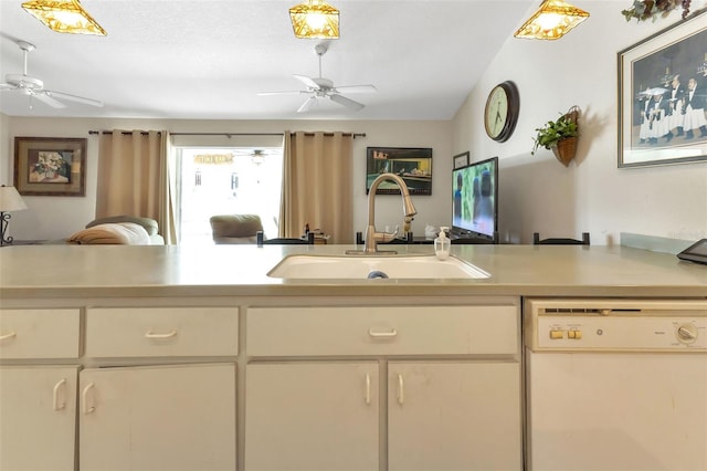 kitchen with dishwasher, a textured ceiling, and sink