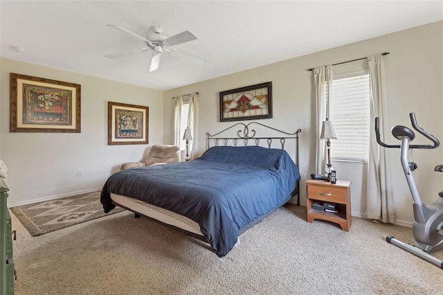 bedroom featuring multiple windows, ceiling fan, and carpet floors