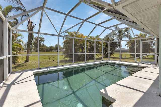 view of swimming pool with a lanai and a patio area