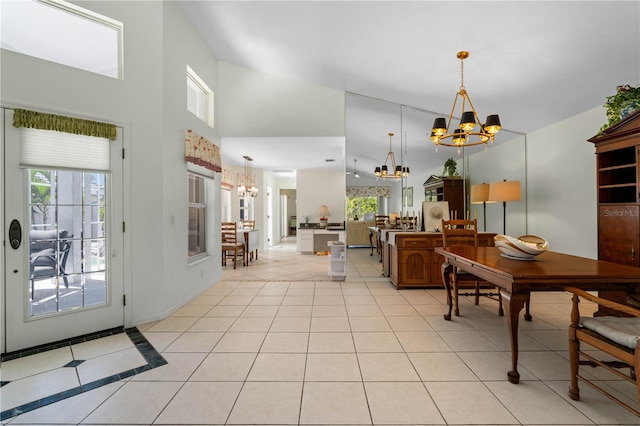 dining area with a notable chandelier and light tile floors