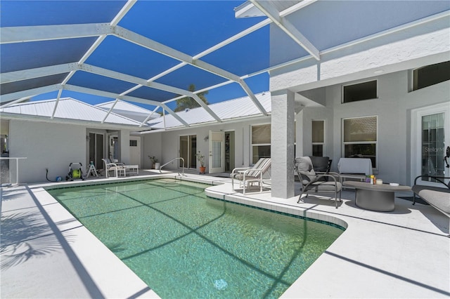 view of pool featuring a lanai, a patio area, and an outdoor living space