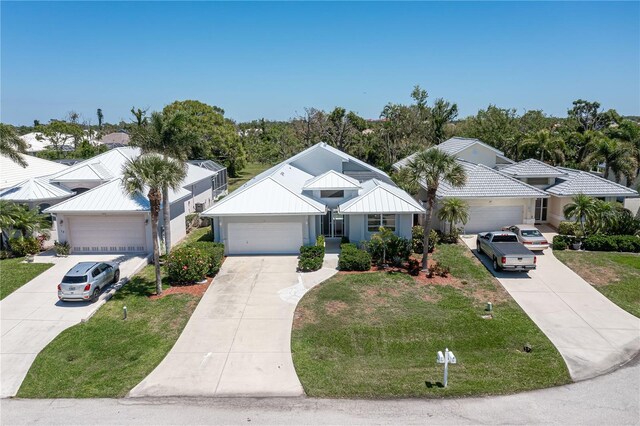 view of front of house with a front lawn and a garage