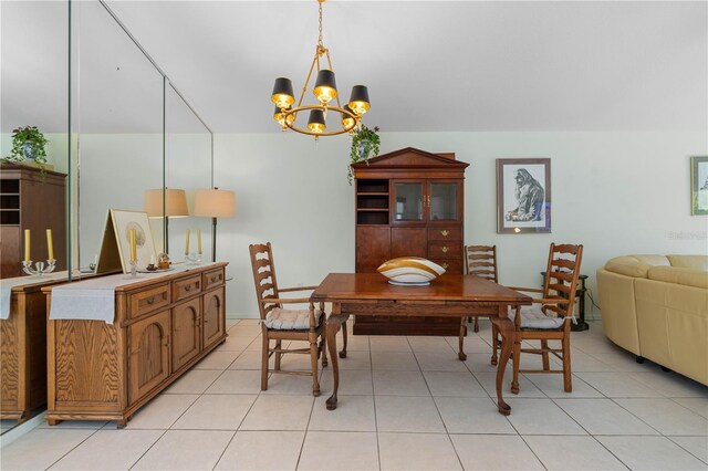 tiled dining space with a notable chandelier