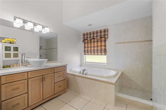 bathroom with vanity, tile flooring, and independent shower and bath