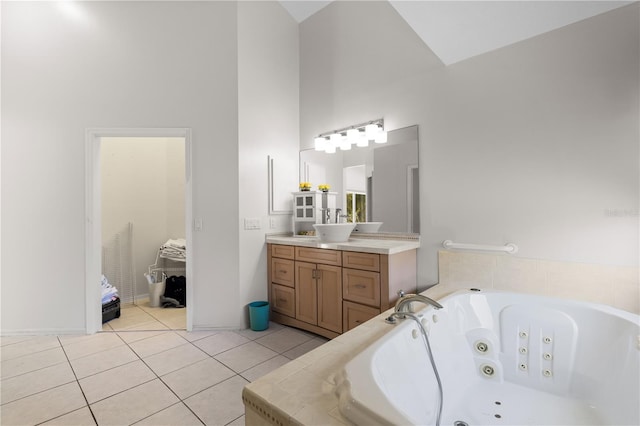 bathroom with tile floors, vanity, and high vaulted ceiling