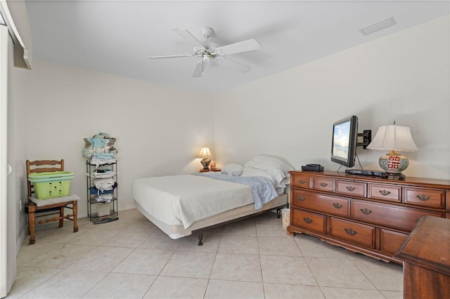 tiled bedroom with ceiling fan