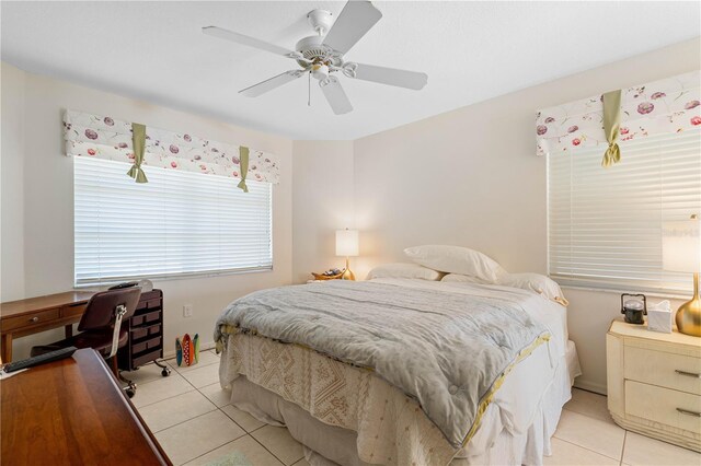 bedroom with light tile floors and ceiling fan