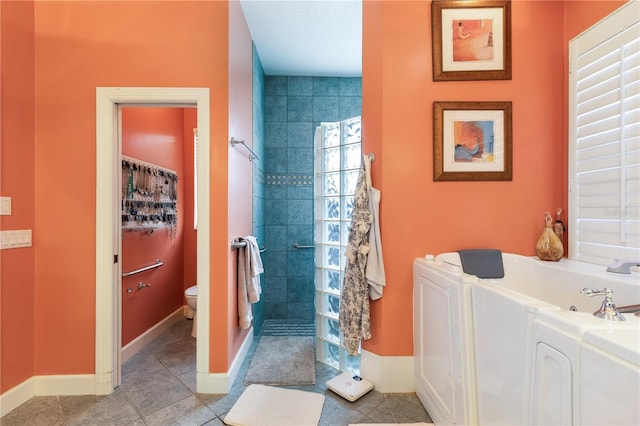 bathroom with tile floors and toilet