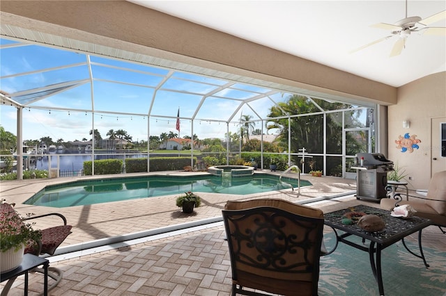 view of pool featuring ceiling fan, a grill, a patio area, an in ground hot tub, and glass enclosure