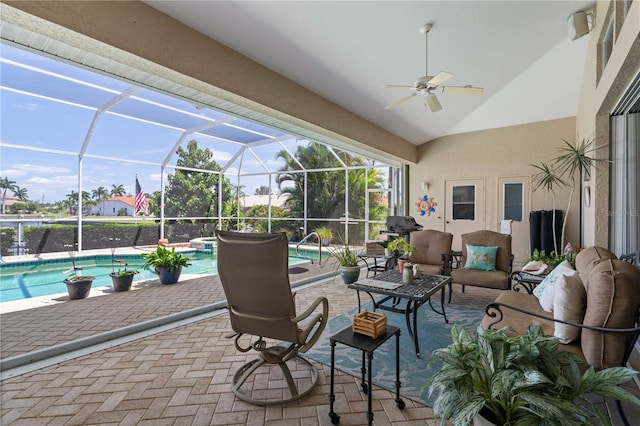 sunroom featuring ceiling fan