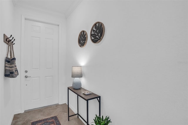 foyer entrance featuring crown molding and light tile floors