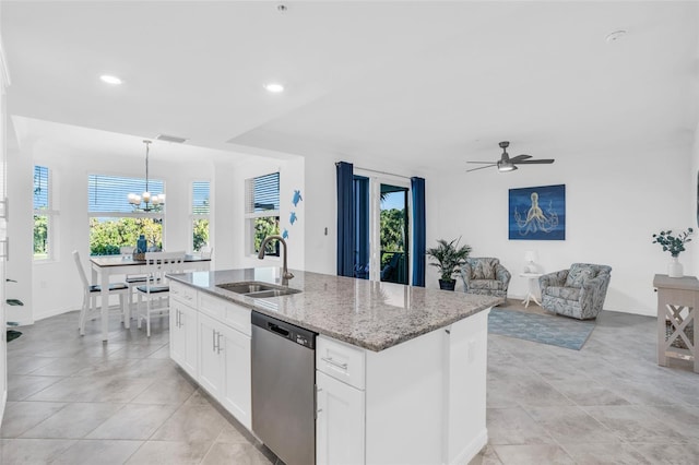 kitchen with white cabinets, dishwasher, light tile floors, and plenty of natural light