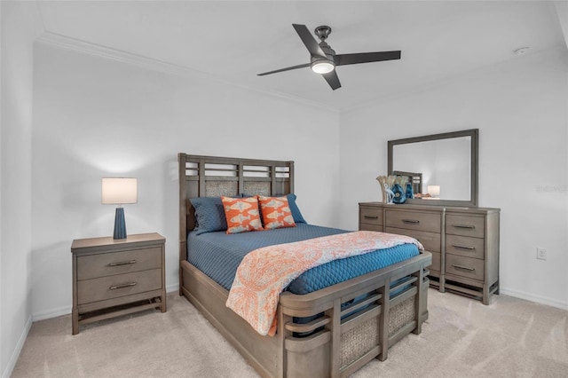 carpeted bedroom with ceiling fan and crown molding