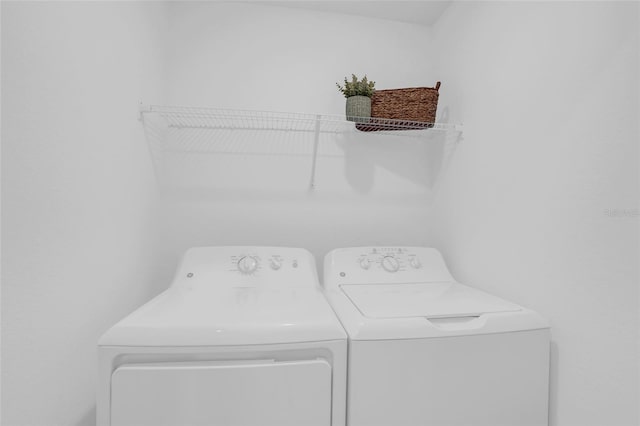 clothes washing area featuring washing machine and clothes dryer