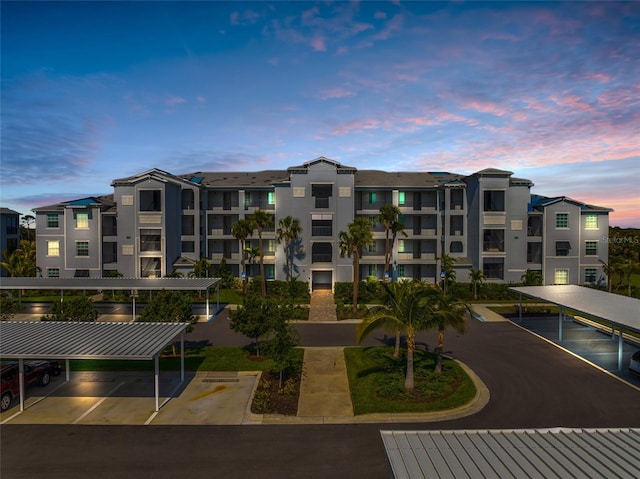 view of outdoor building at dusk