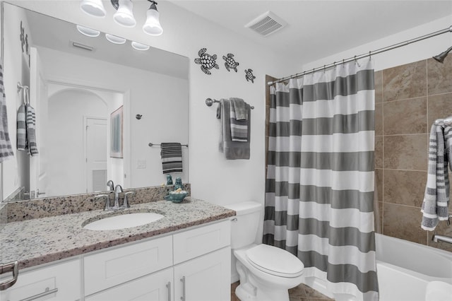 full bathroom featuring toilet, shower / bathtub combination with curtain, visible vents, and vanity