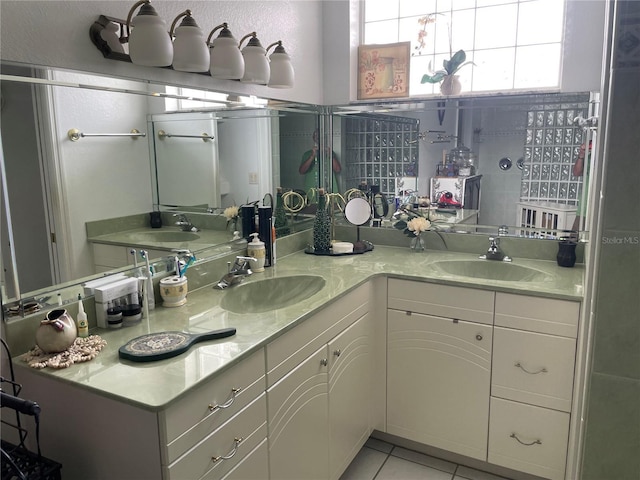 bathroom with tile patterned flooring and vanity