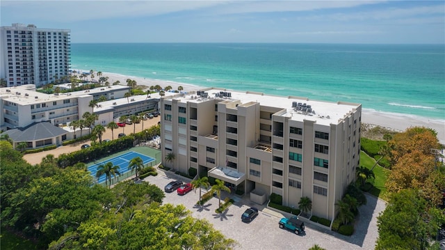 birds eye view of property featuring a water view and a view of the beach