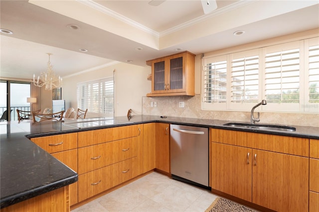 kitchen featuring sink, crown molding, plenty of natural light, and stainless steel dishwasher