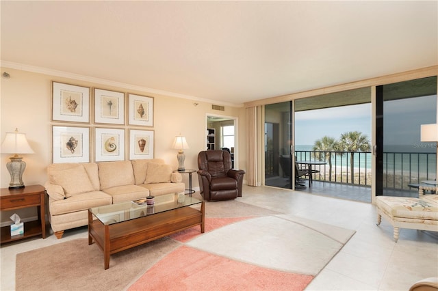 tiled living room featuring a wall of windows, crown molding, and a water view