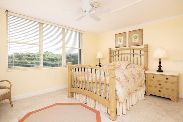 bedroom with ceiling fan and ornamental molding