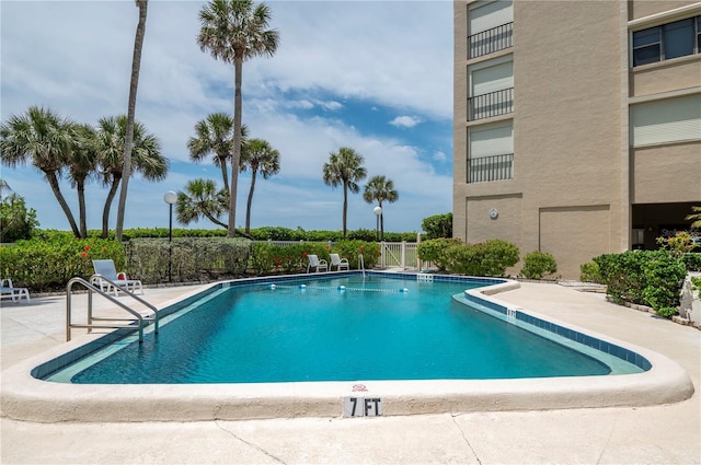 view of swimming pool with a patio