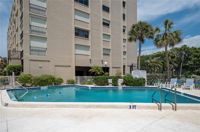 view of swimming pool with a patio area