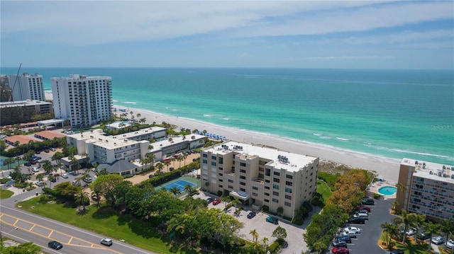 aerial view featuring a water view and a beach view