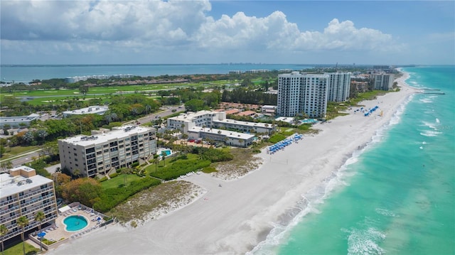 birds eye view of property featuring a water view and a view of the beach