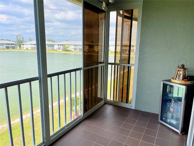 unfurnished sunroom with a water view and plenty of natural light