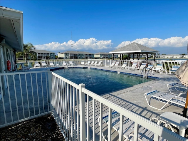 view of pool featuring a patio and a gazebo