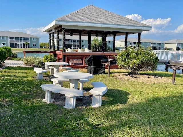 exterior space with a water view and a yard