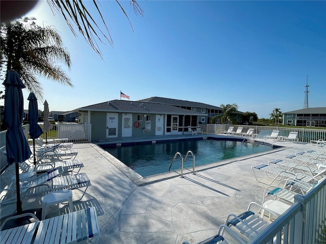 view of swimming pool featuring a patio area