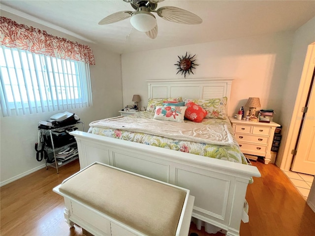 bedroom with light wood-type flooring and ceiling fan