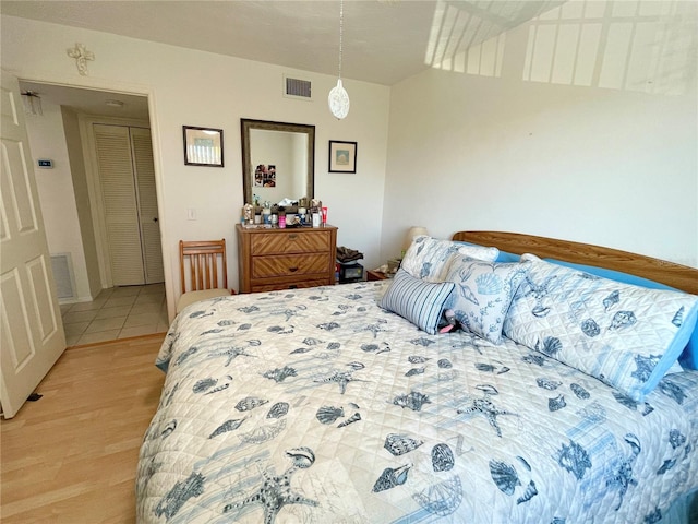 bedroom featuring light wood-type flooring