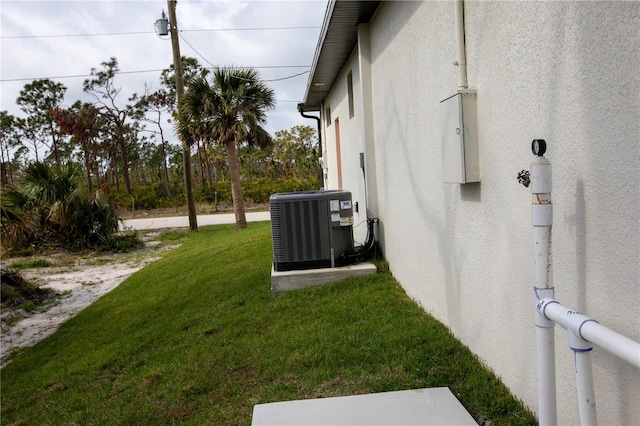 view of yard featuring central AC unit