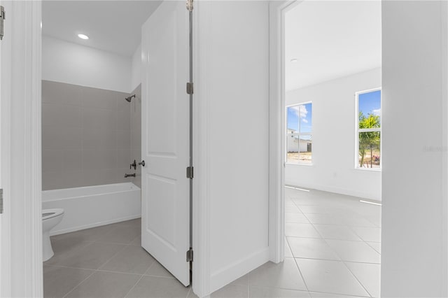 corridor with light tile patterned flooring