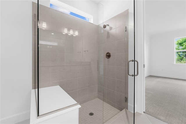 bathroom with tile patterned flooring and an enclosed shower