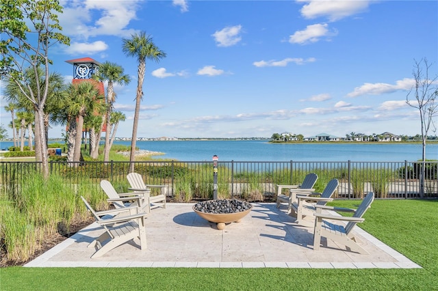 view of patio featuring a fire pit and a water view