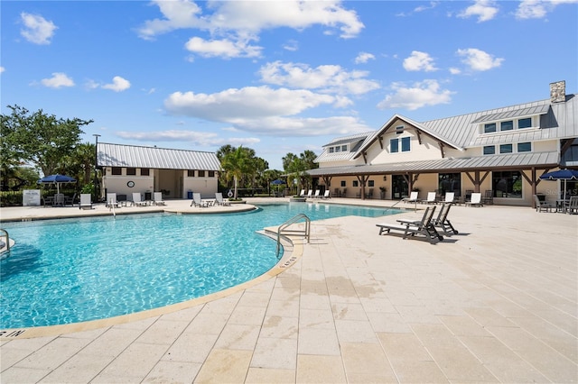 view of swimming pool featuring a patio