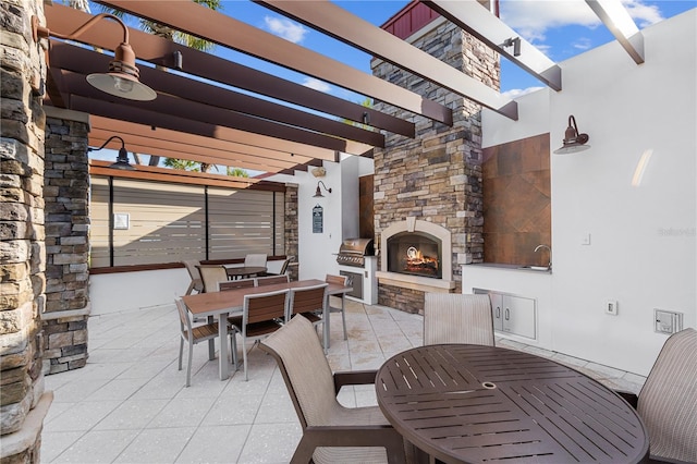 view of patio / terrace featuring an outdoor stone fireplace, a pergola, and a grill