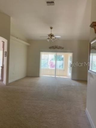 empty room with light carpet and ceiling fan