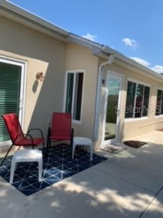 rear view of property with a patio