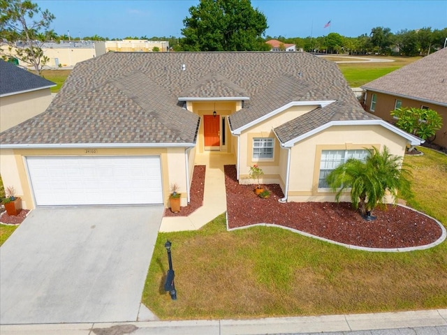 view of front of house featuring a garage and a front yard