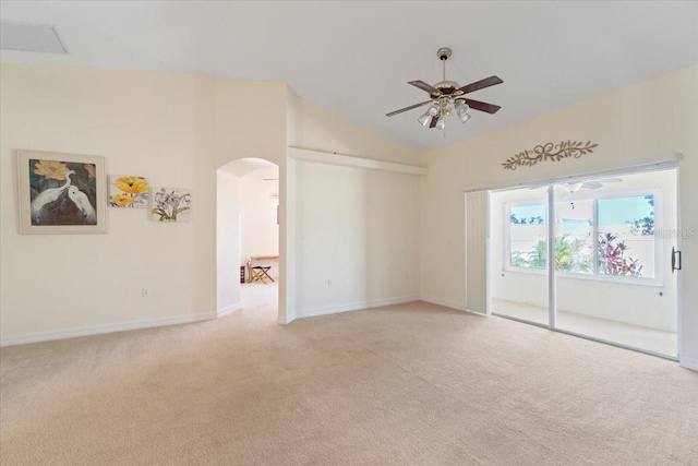 carpeted spare room with ceiling fan and lofted ceiling