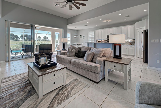 tiled living room featuring ceiling fan