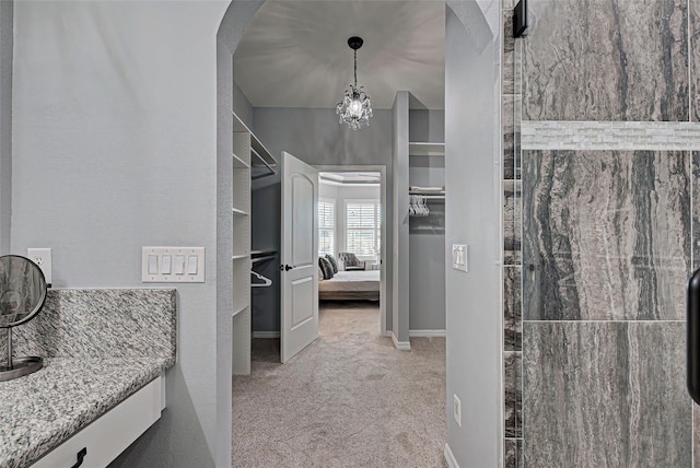 bathroom featuring a chandelier