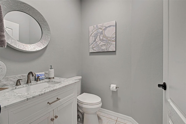 bathroom featuring oversized vanity, tile floors, and toilet