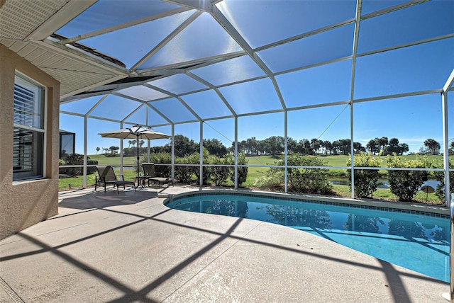 view of pool with a lanai and a patio