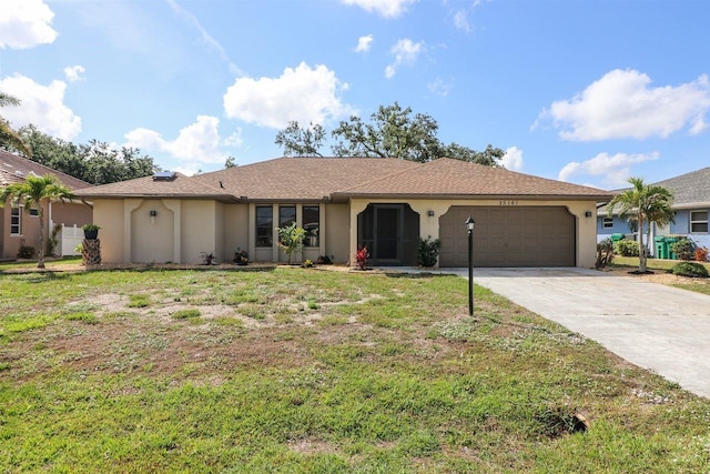 single story home with a garage and a front yard